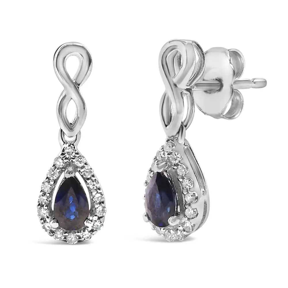 Blue Sapphire and 1/7 CTTW Diamond Infinity Drop Earrings in 10K White Gold