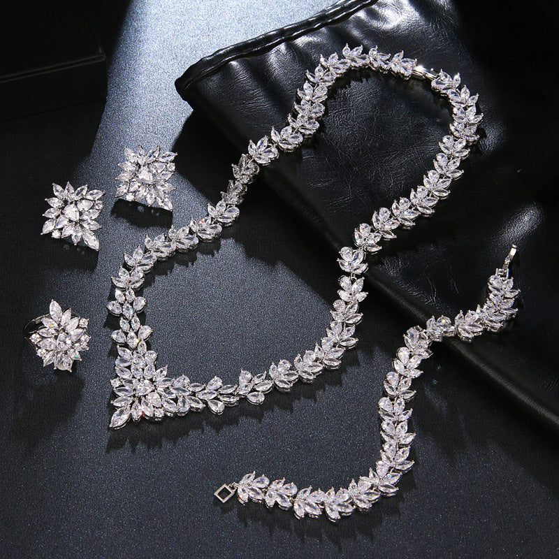 The Dazzling Set Is Handcrafted With Copper And Set With Zircon Stones.