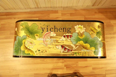 Decorative rug with floral and fish design on a wooden floor