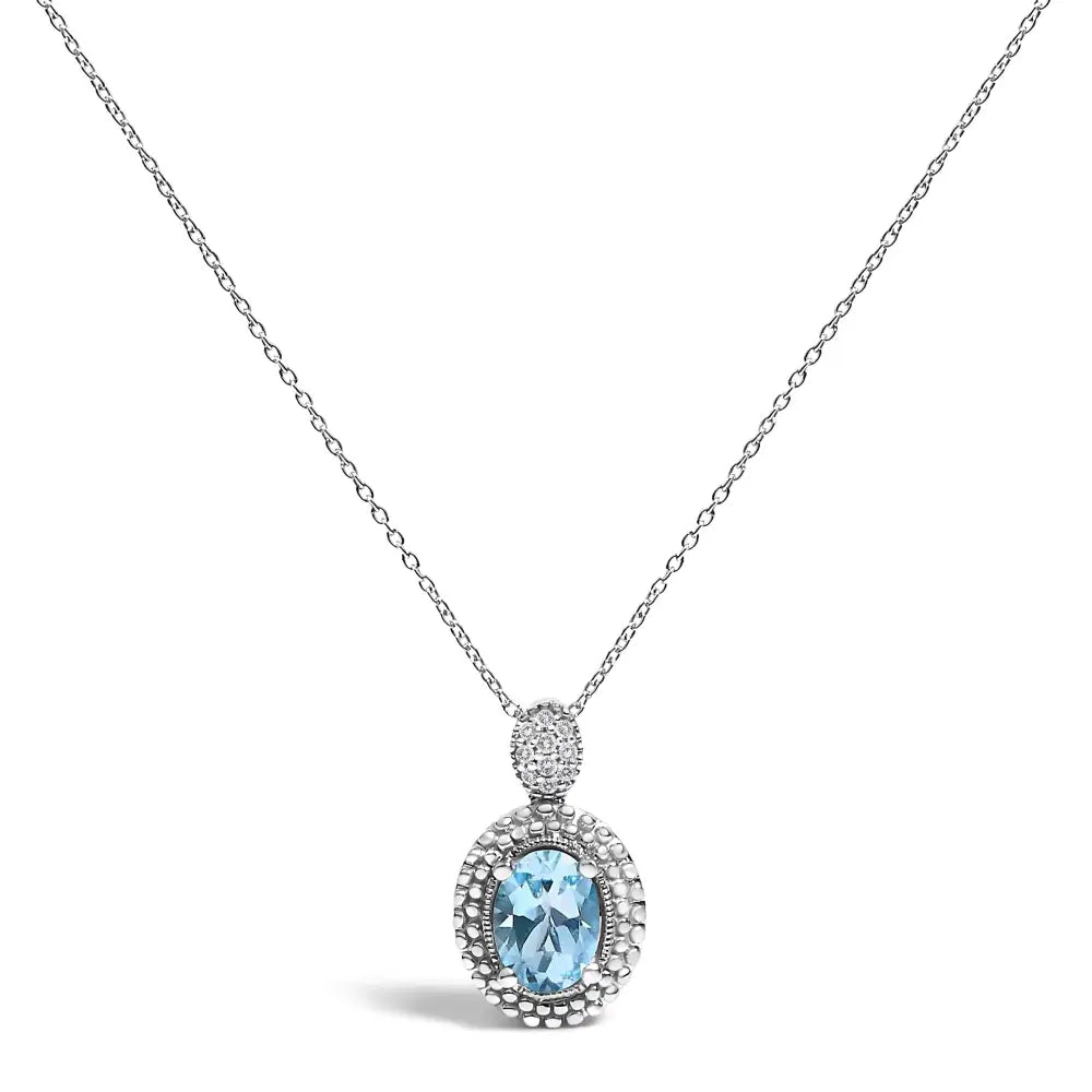 Oval Blue Topaz and Diamond Beaded Halo Pendant in Sterling Silver