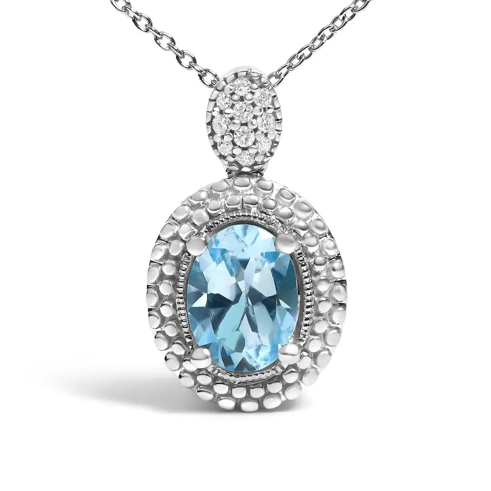 Oval Blue Topaz and Diamond Beaded Halo Pendant in Sterling Silver