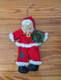 Plush Santa with Wreath from Unknown -  Holiday Decor (Fabric, Faux Fur, Plastic, String Ornament, Handmade, Craft, Traditional, Red, White, Green)