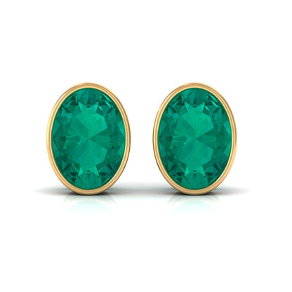 1.4 Carat Bezel Set Oval Cut Emerald Solitaire Stud Earrings