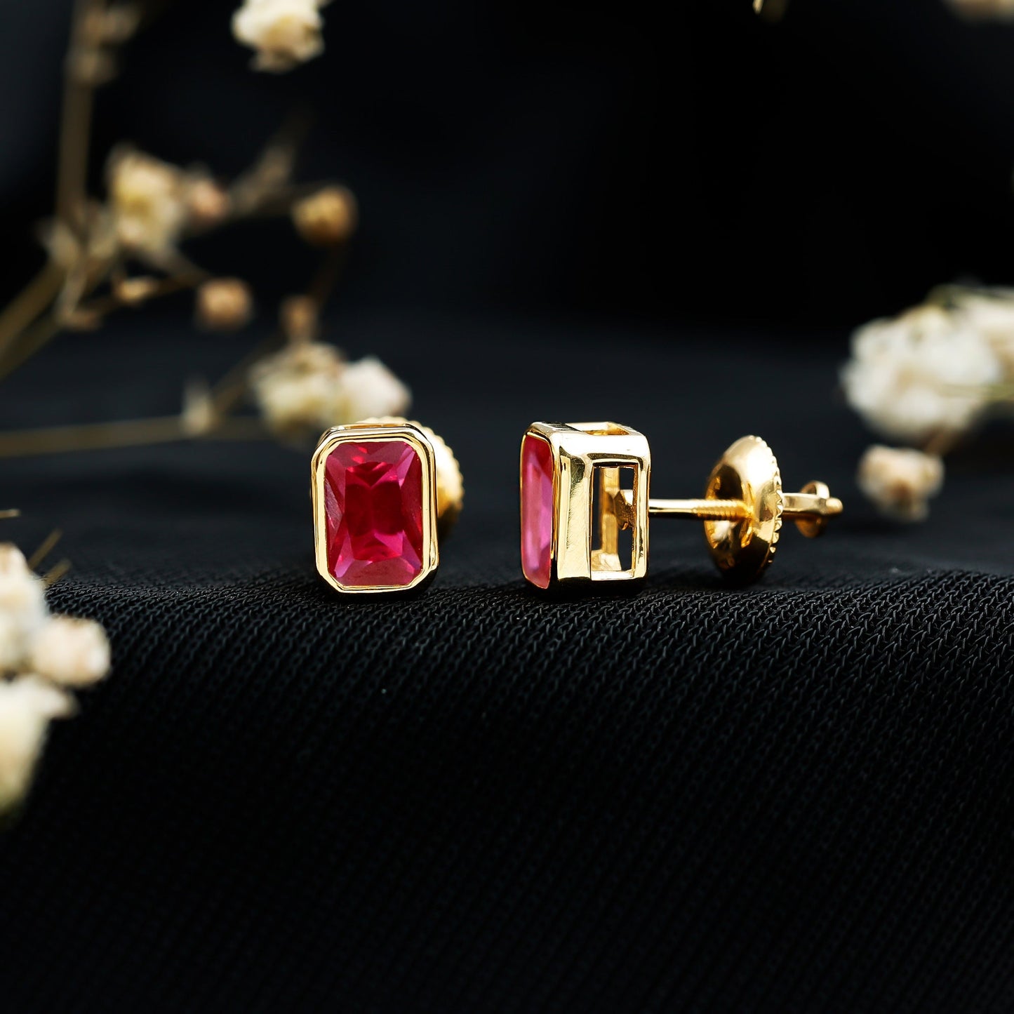 1.5 Carat Emerald Cut Lab Grown Ruby Stud Earrings in Bezel Set