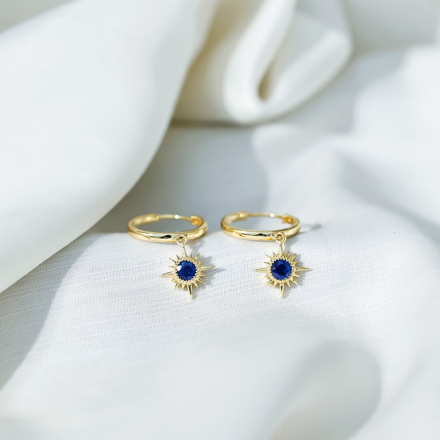 Bezel Set Blue Sapphire Sunburst Drop Hoop Earrings