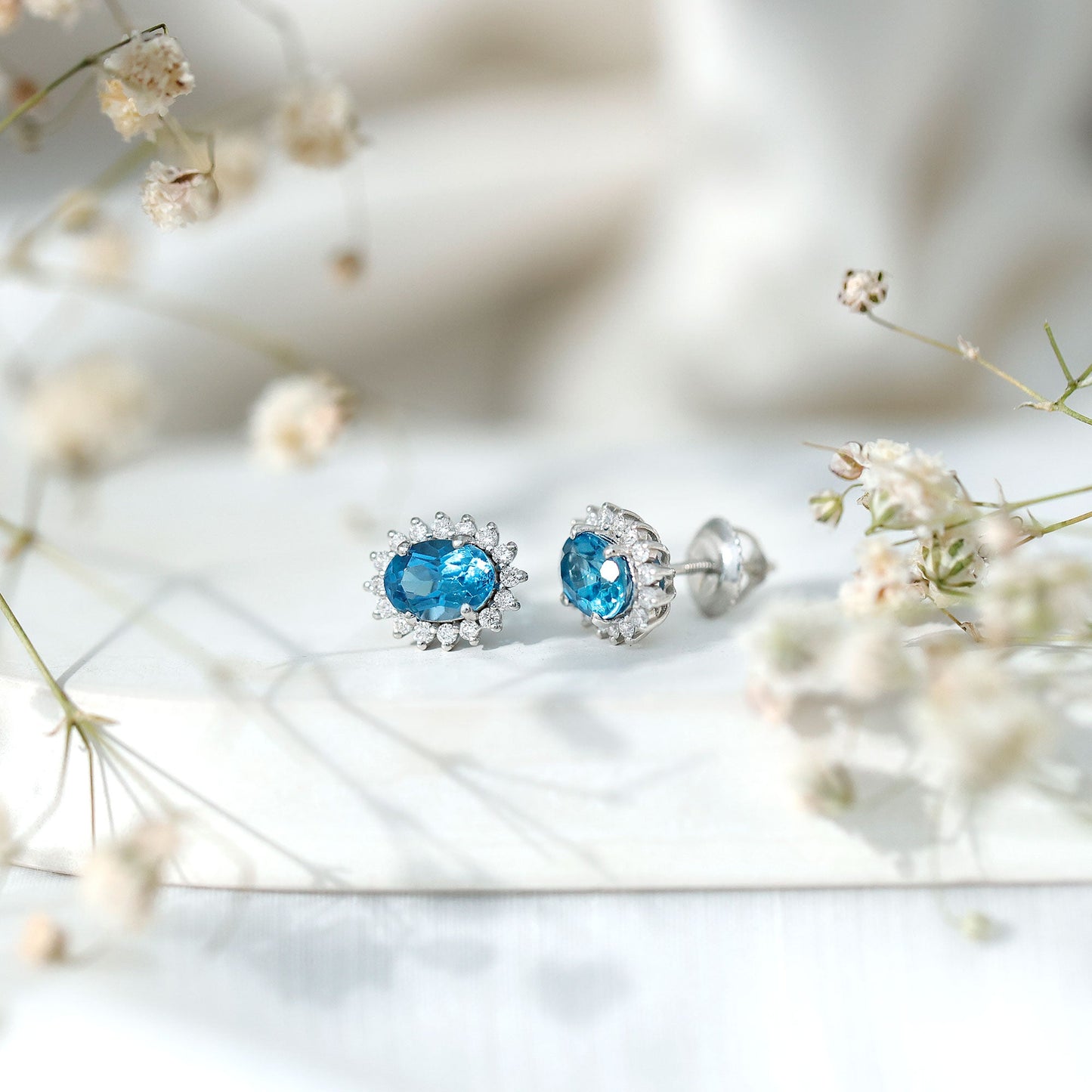 1.6 Carat Oval London Blue Topaz Stud Earrings with Diamond Halo