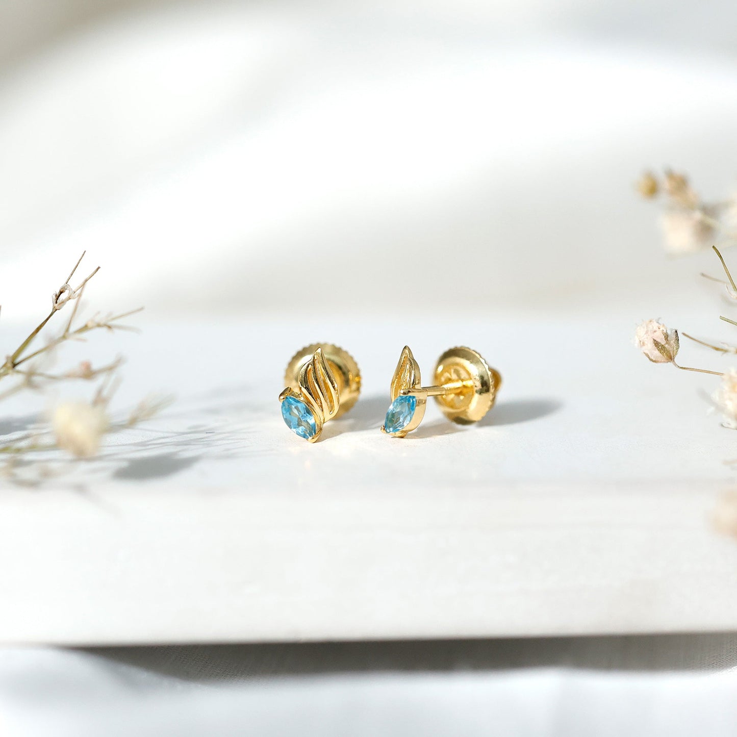 Natural Swiss Blue Topaz Leaf Earrings in Silver