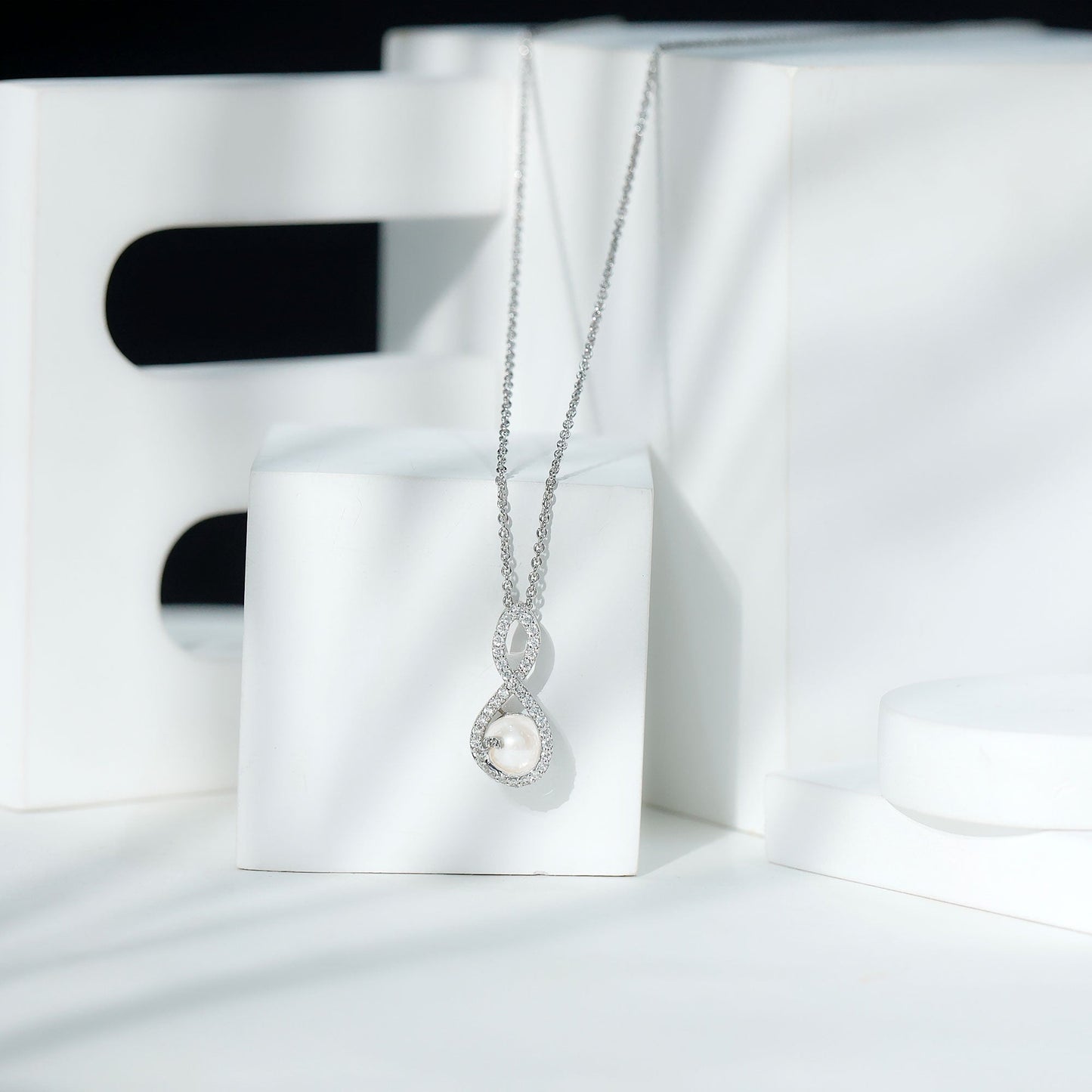Freshwater White Pearl and Moissanite Infinity Pendant in Silver