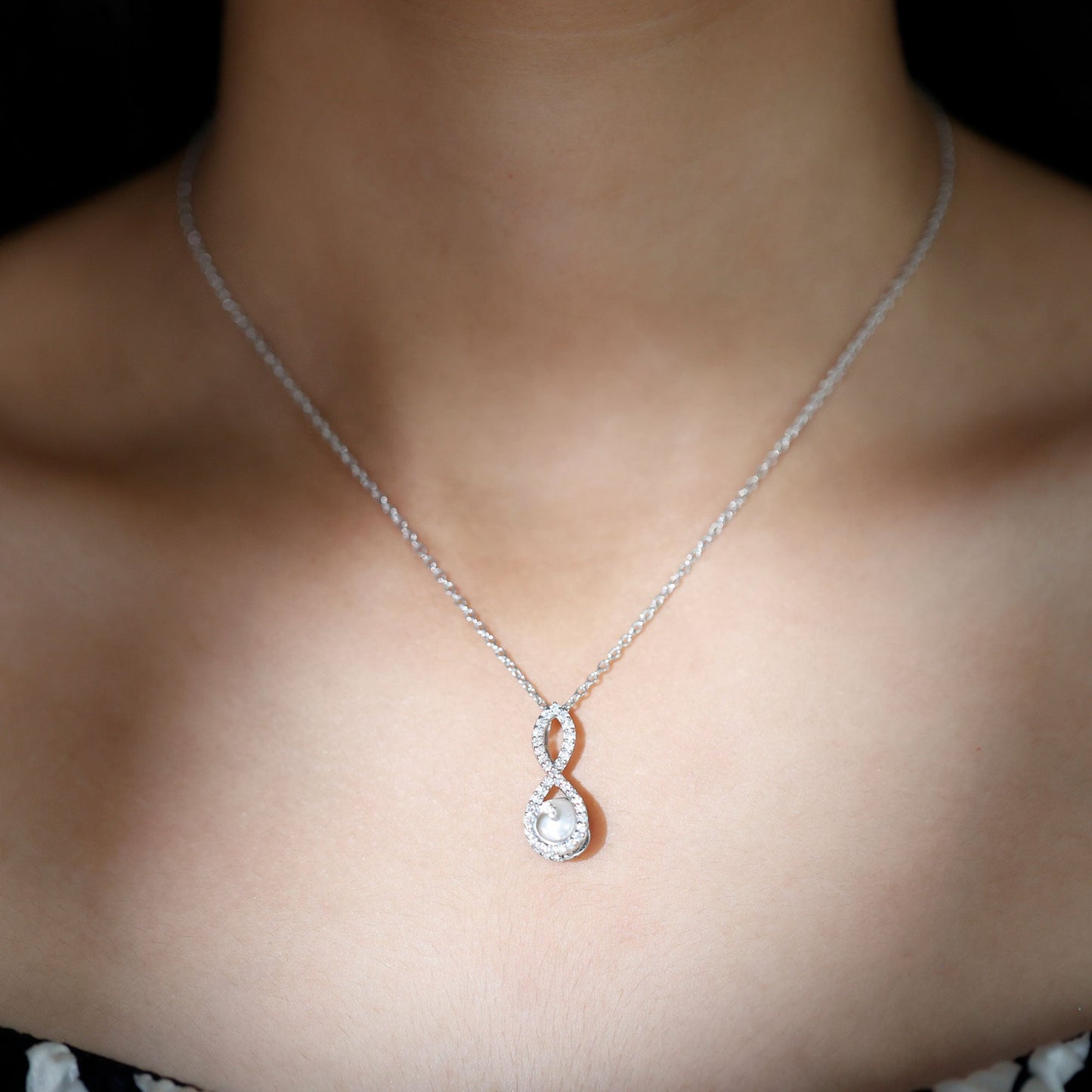 Freshwater White Pearl and Moissanite Infinity Pendant in Silver