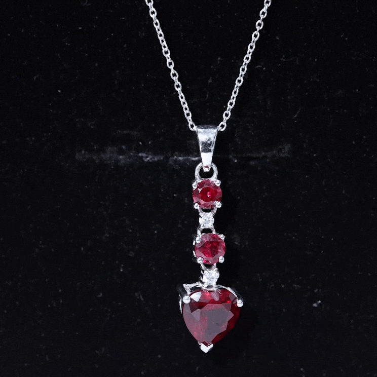 Created Ruby and Moissanite Heart Dangle Pendant Necklace