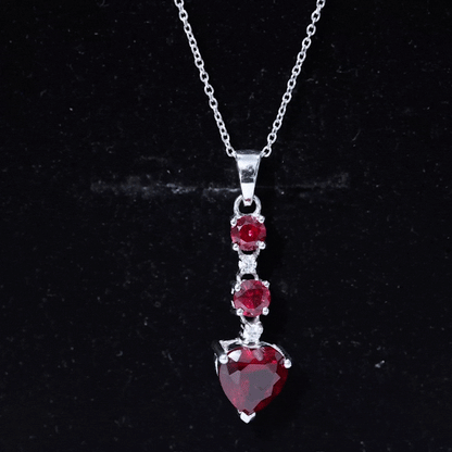 Created Ruby and Moissanite Heart Dangle Pendant Necklace