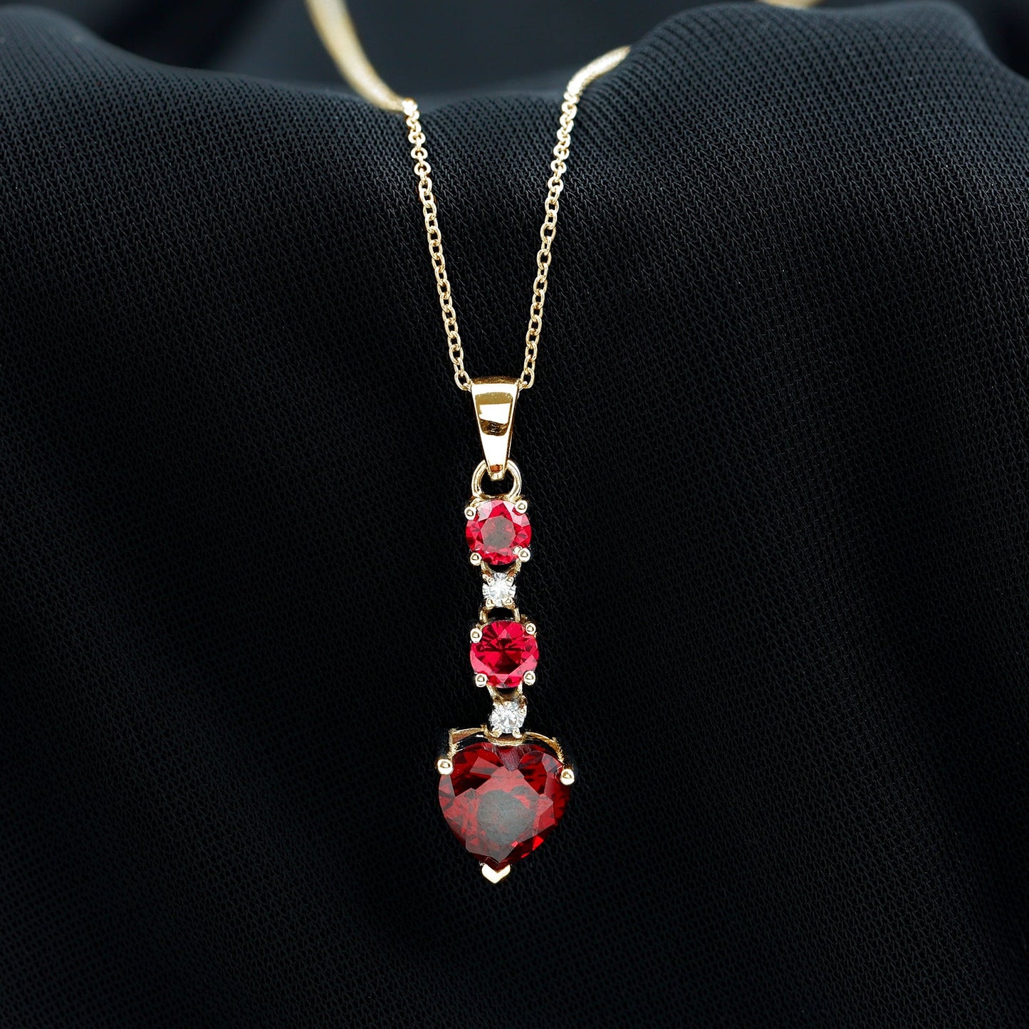 Created Ruby and Moissanite Heart Dangle Pendant Necklace