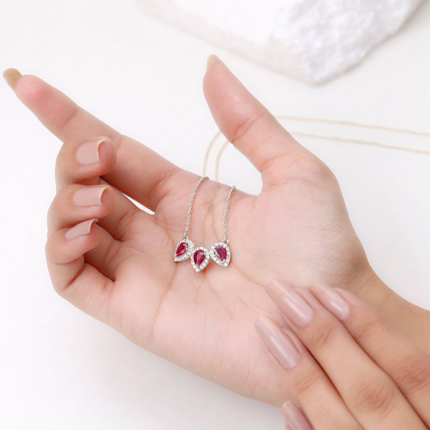 Pear Cut Lab Created Ruby Three Stone Necklace with Moissanite Halo