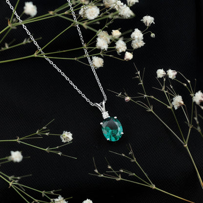 Oval Created Emerald and Moissanite Solitaire Pendant