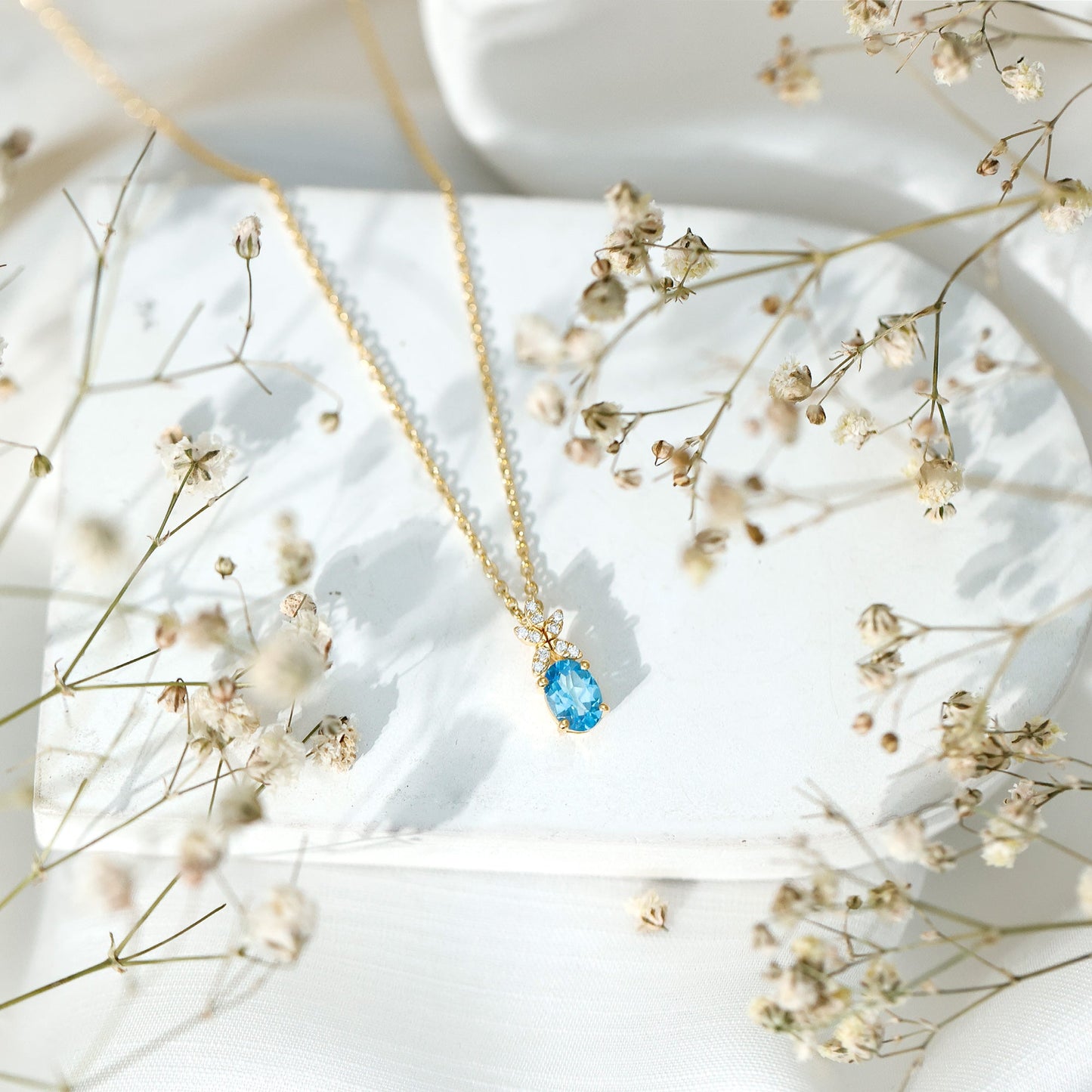 Oval Cut 0.65 Carat Swiss Blue Topaz and Diamond Flower Necklace with Chain