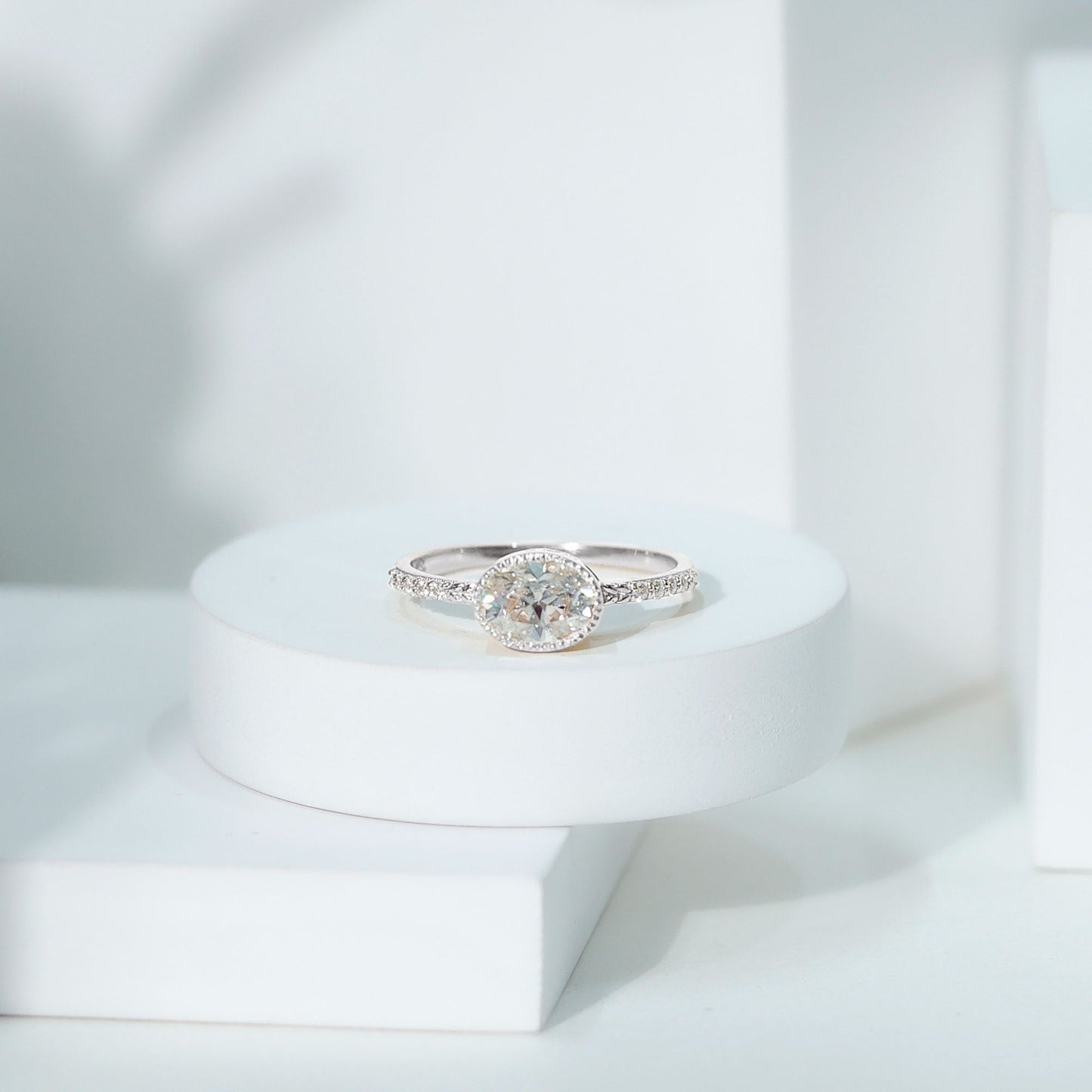 Moissanite East West Engagement Ring in Bezel Setting