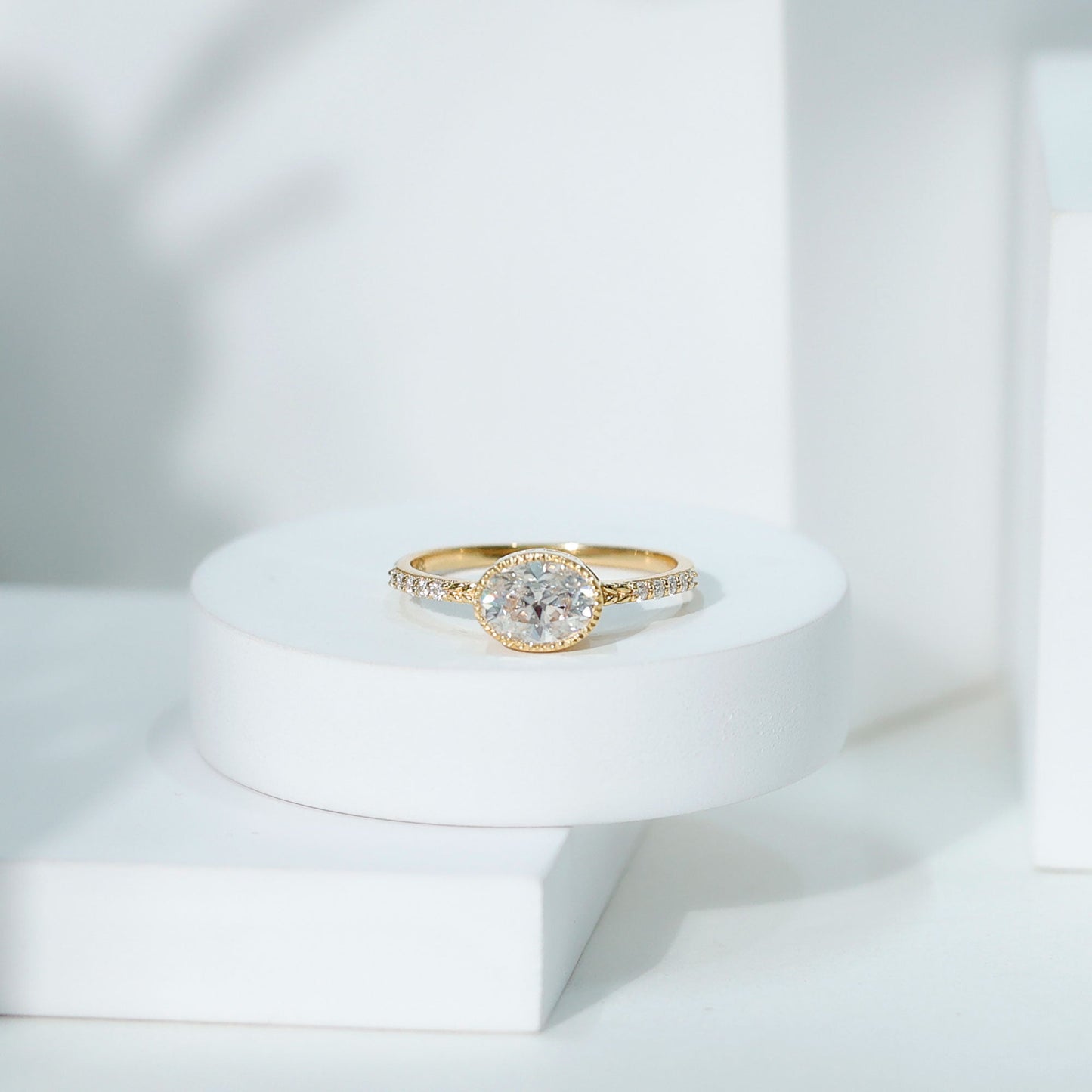 Moissanite East West Engagement Ring in Bezel Setting