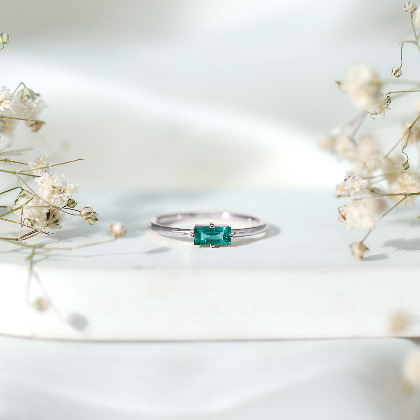 East West Set Baguette Cut Emerald May Birthstone Ring
