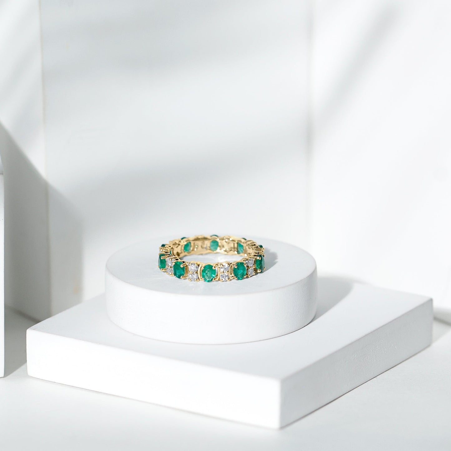 Oval Emerald and Moissanite Eternity Wedding Band