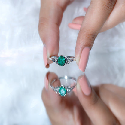 Oval Shaped Emerald Celtic Engagement Ring in Bezel Setting