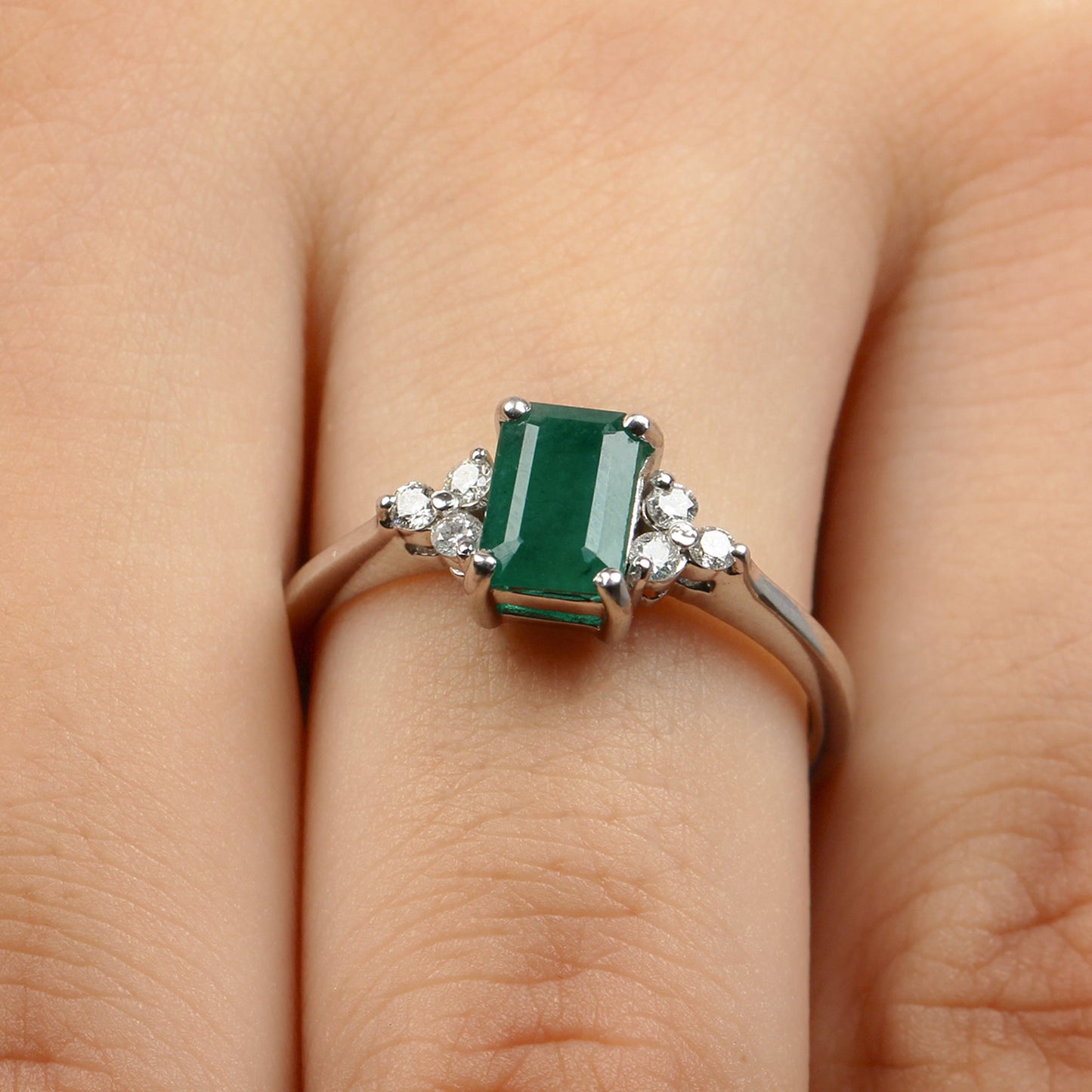 Octagon Cut Emerald Engagement Ring with Diamond Trio