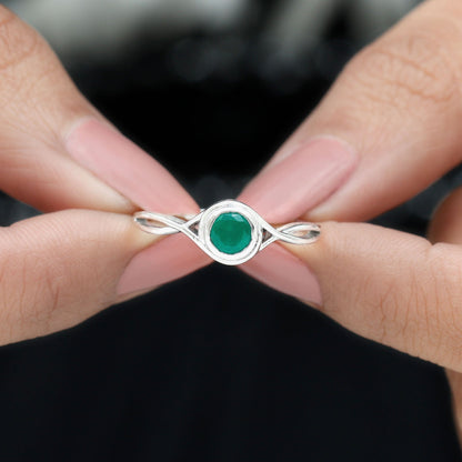 Round Cut Emerald Solitaire Ring with Crossover Band