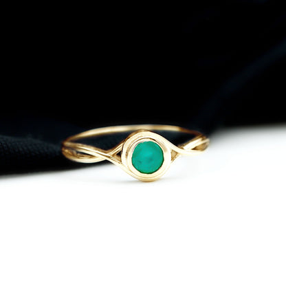 Round Cut Emerald Solitaire Ring with Crossover Band