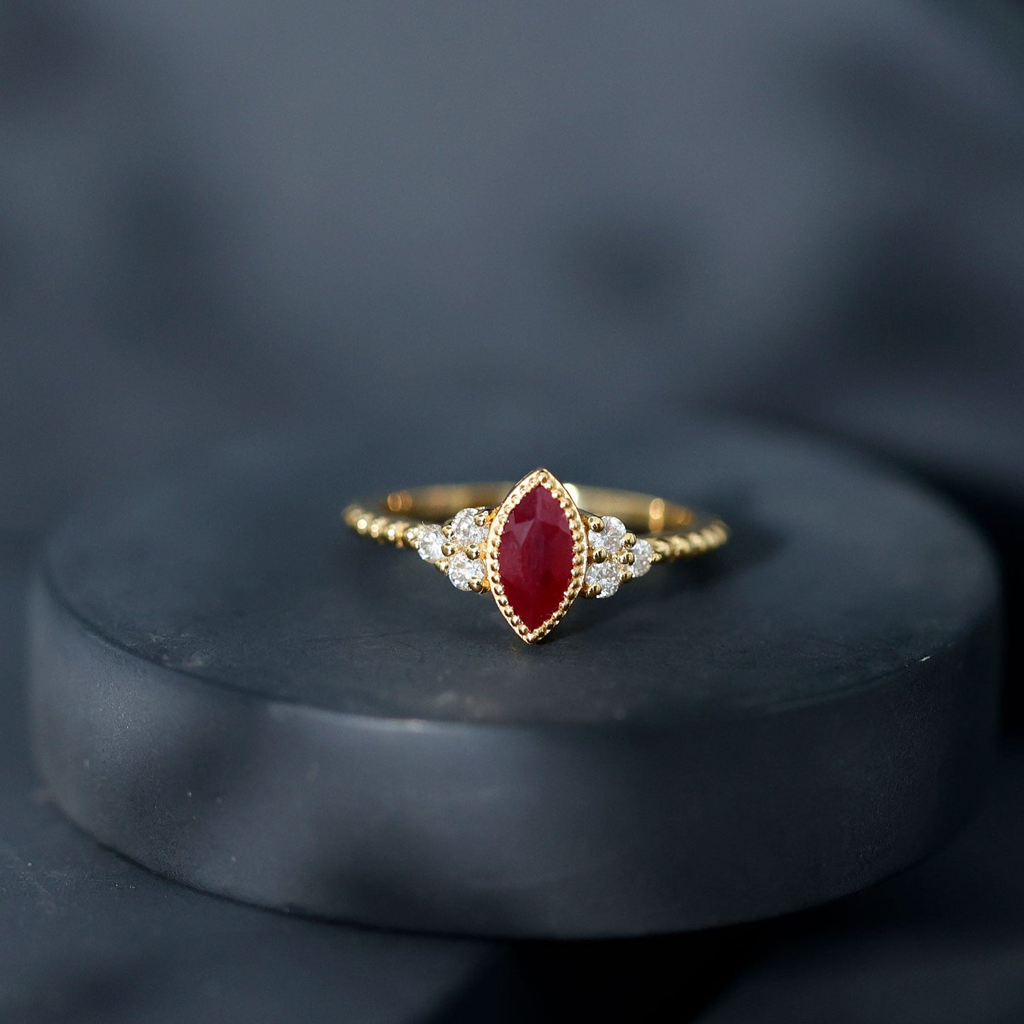 Vintage Style 0.75 Carat Ruby Marquise Engagement Ring with Diamond Trio