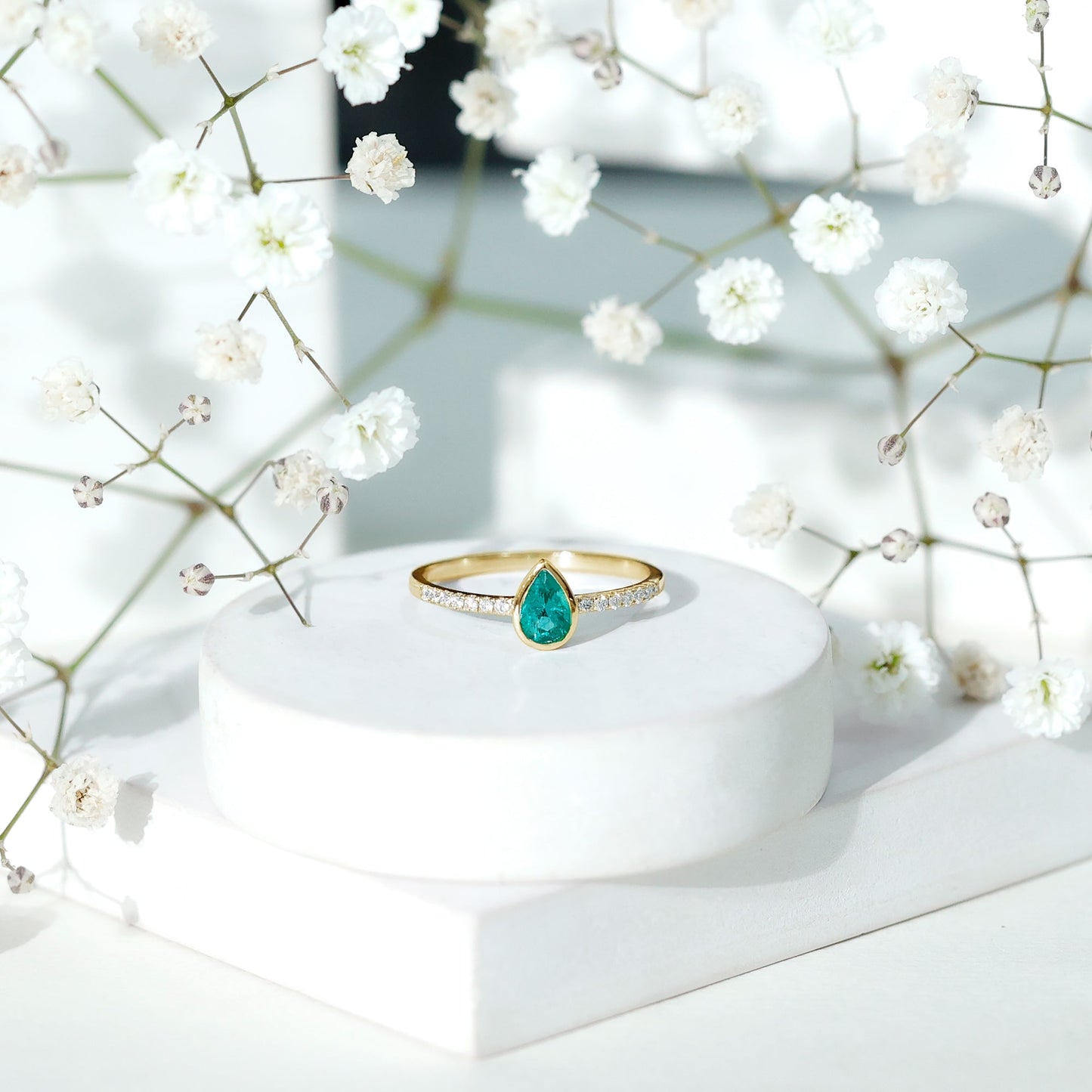 Pear Shaped Emerald Engagement Ring with Diamond Side Stones