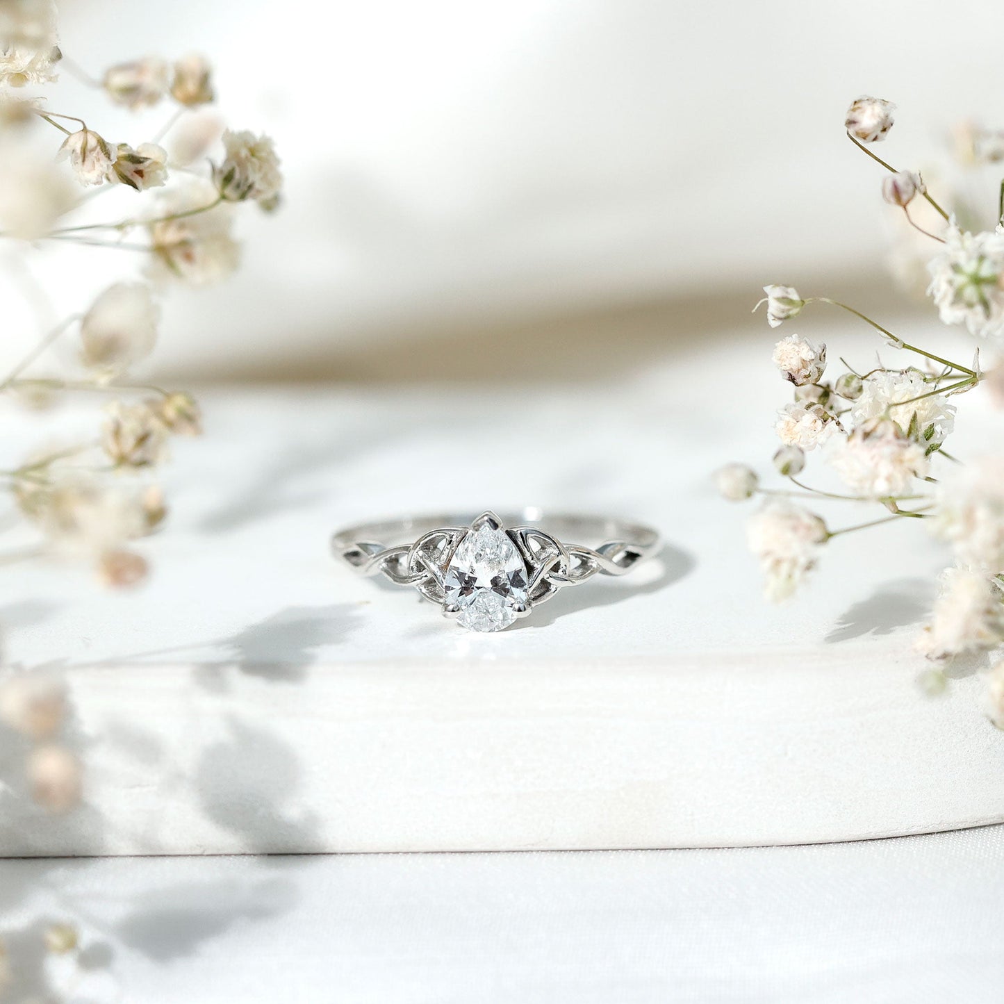 Pear Cut 0.79 Carat Moissanite Celtic Engagement Ring