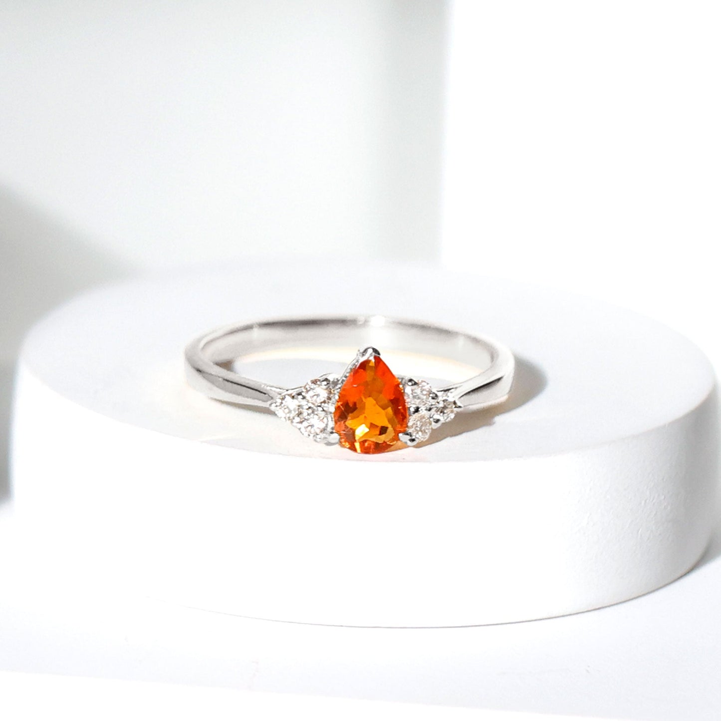 0.6 Carat Pear Shaped Fire Opal Engagement Ring with Diamond Trio