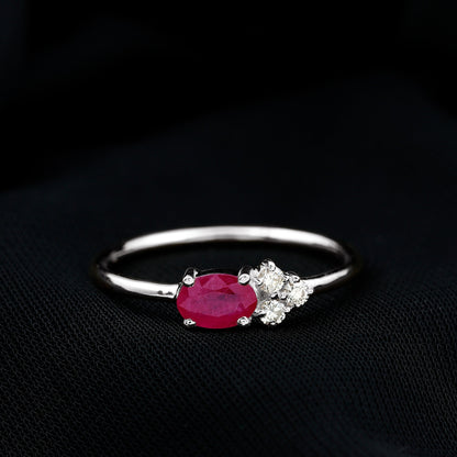 East West Style 0.6 Carat Oval Ruby Promise Ring with Diamond Trio