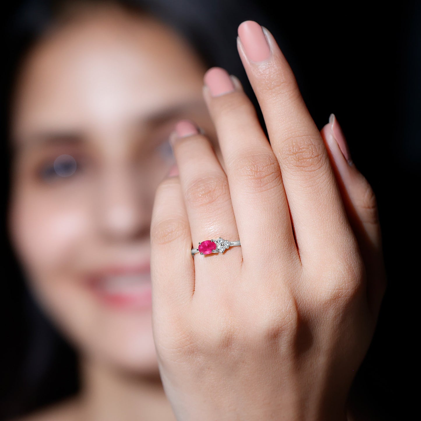 East West Style 0.6 Carat Oval Ruby Promise Ring with Diamond Trio