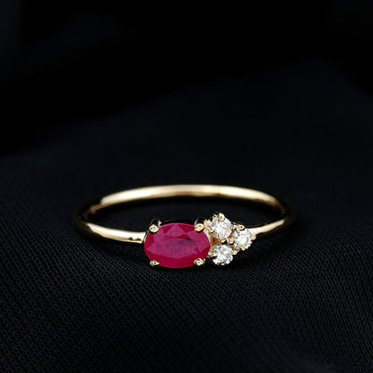 East West Style 0.6 Carat Oval Ruby Promise Ring with Diamond Trio