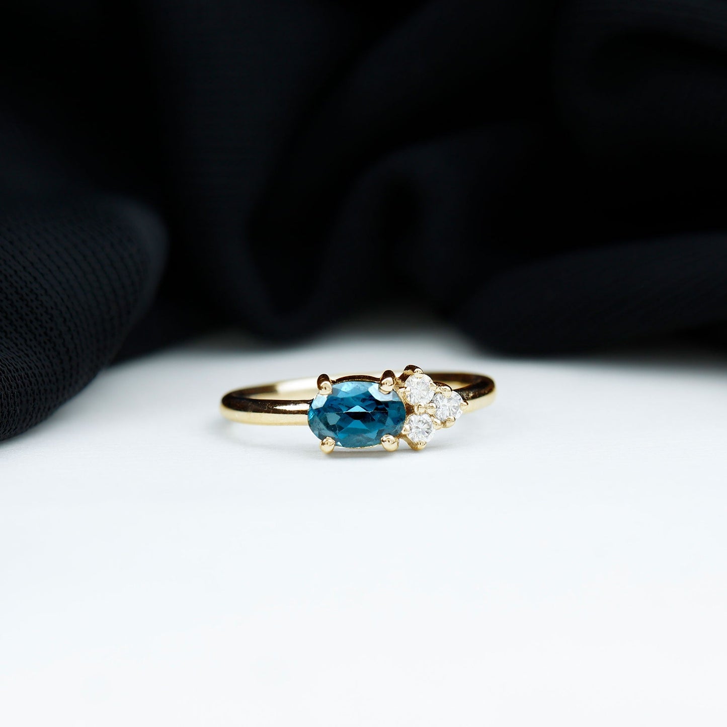 0.4 Carat Oval Cut London Blue Topaz East West Promise Ring with Diamond Trio