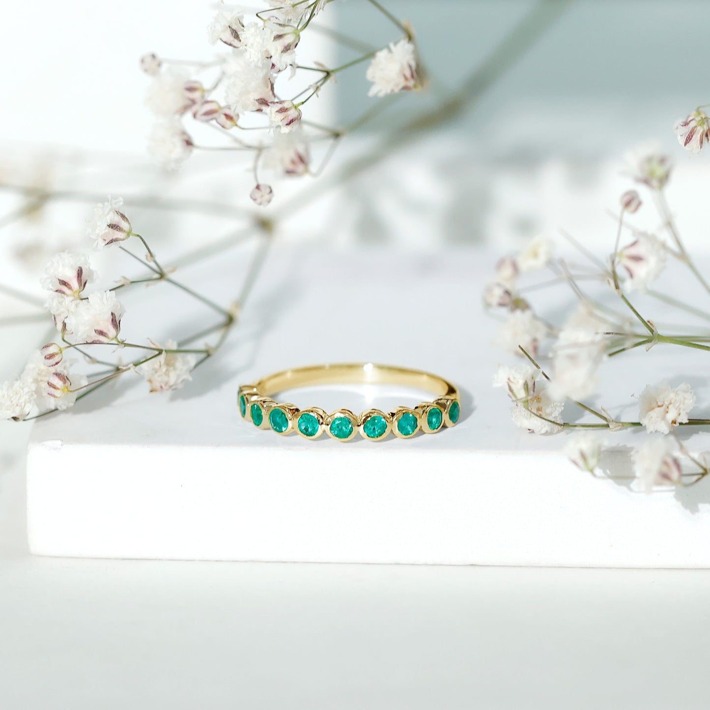 Natural Emerald Half Eternity Ring in Bezel Set