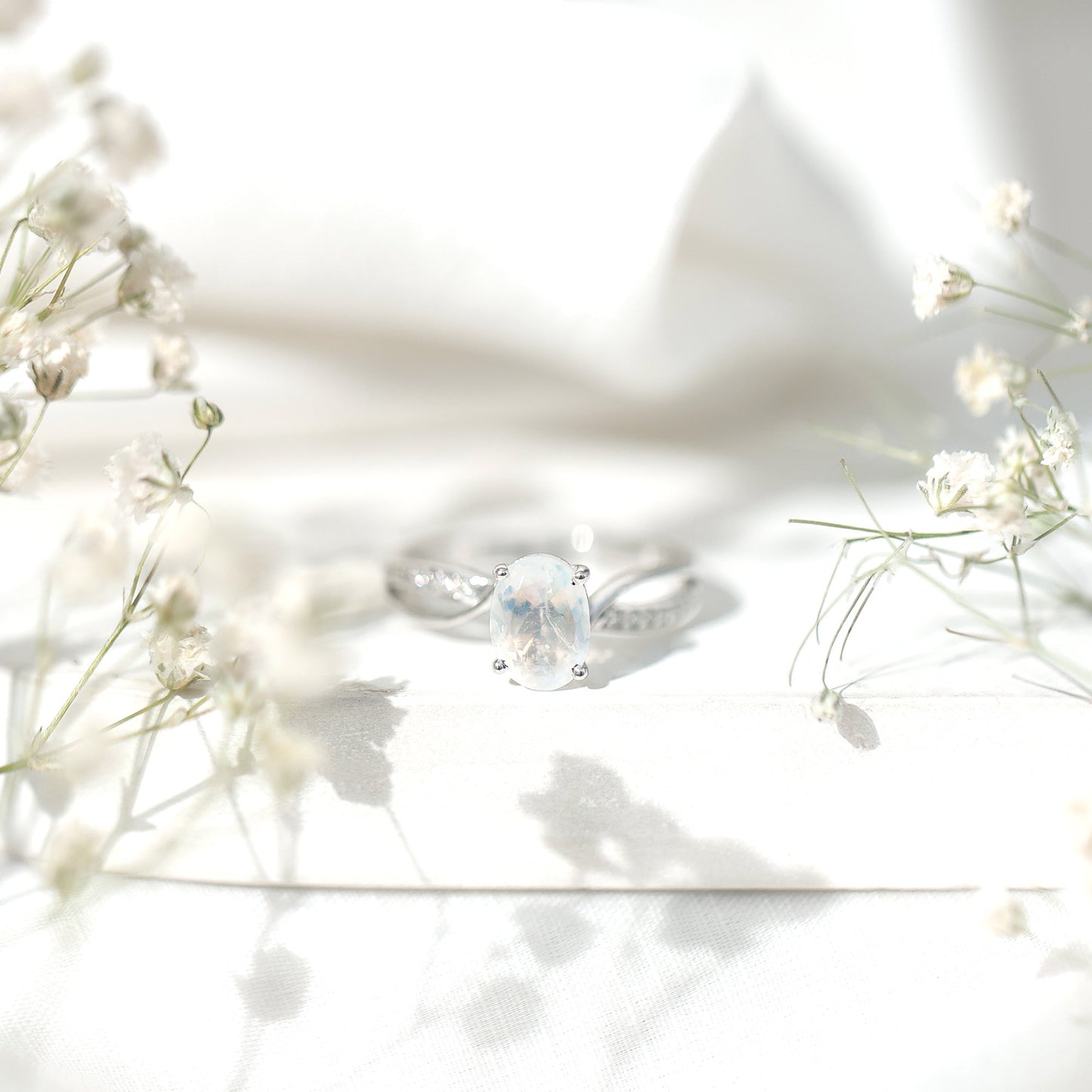 Oval Moonstone Infinity Engagement Ring with Diamond
