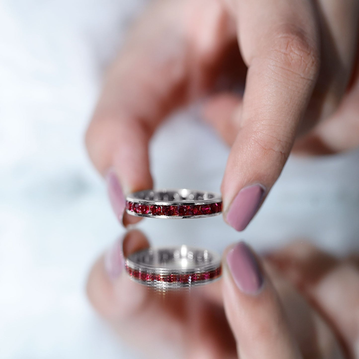 Round Created Ruby Full Eternity Ring in Channel Setting