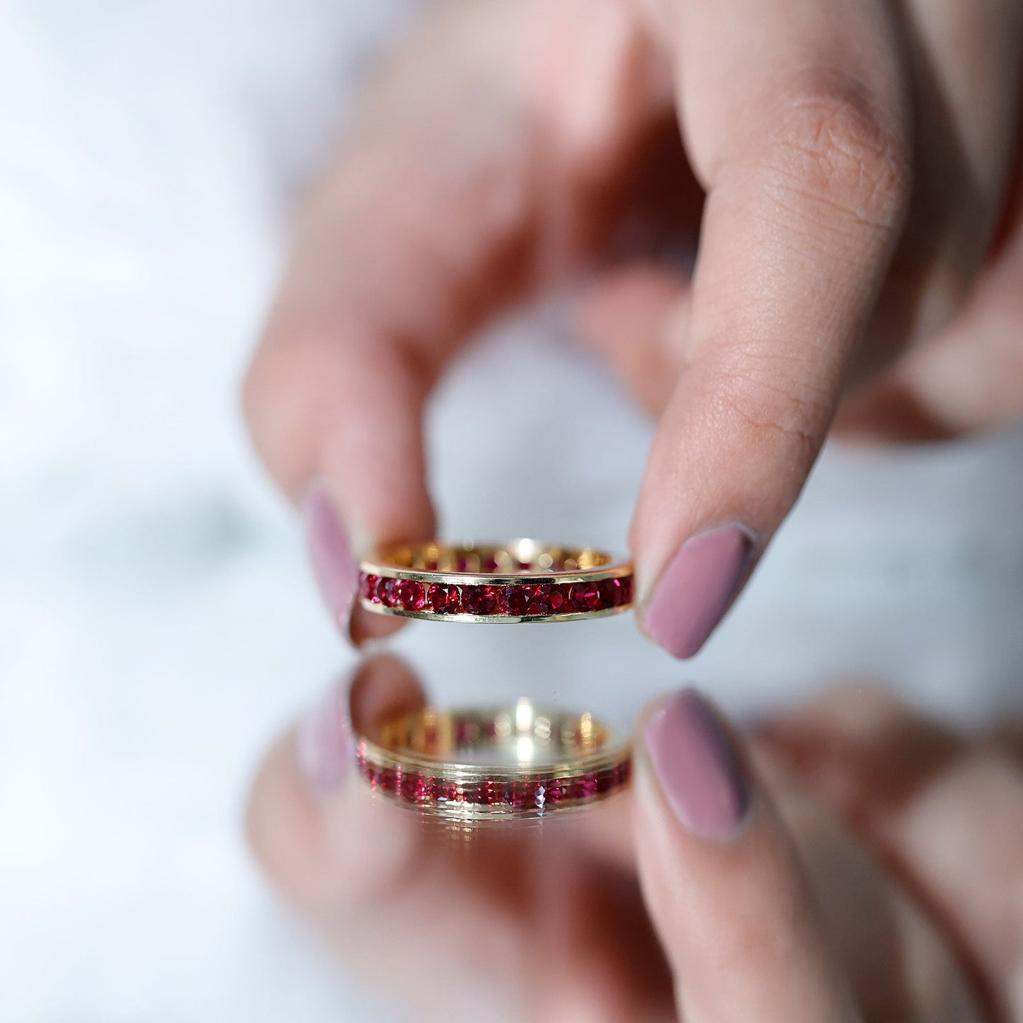 Round Created Ruby Full Eternity Ring in Channel Setting