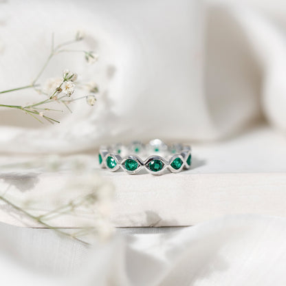 Certified Lab Grown Emerald Infinity Twisted Eternity Ring