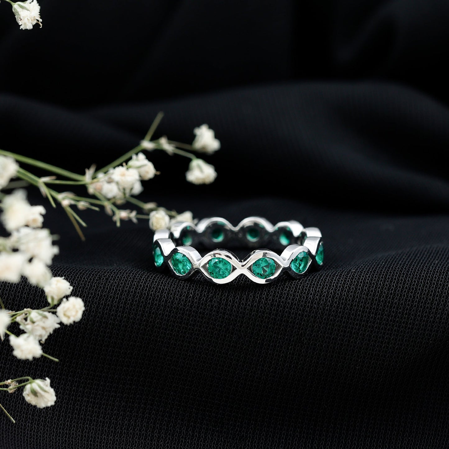Certified Lab Grown Emerald Infinity Twisted Eternity Ring