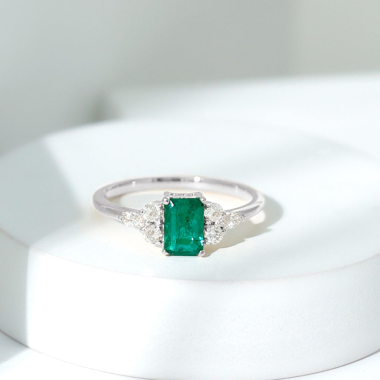 Emerald Cut Emerald Engagement Ring with Diamond Trio