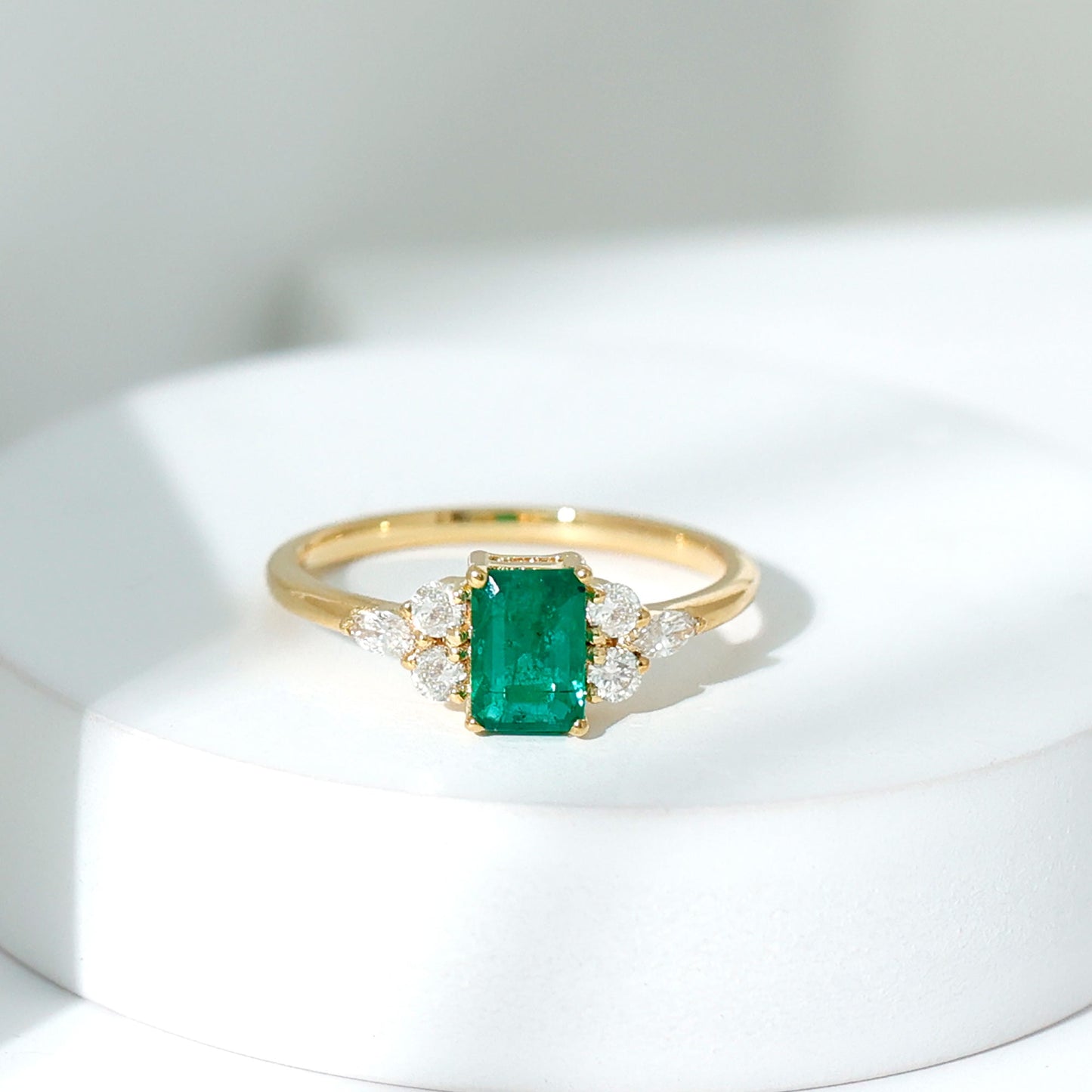 Emerald Cut Emerald Engagement Ring with Diamond Trio