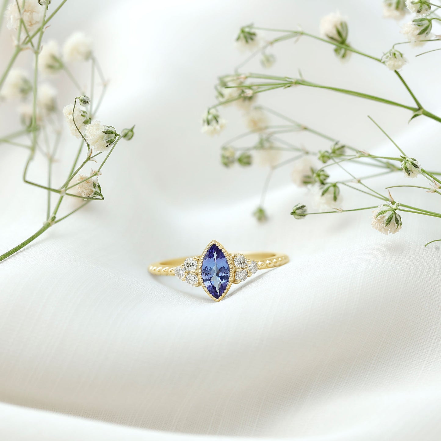 Vintage Style Marquise Tanzanite Promise Ring with Diamond Trio