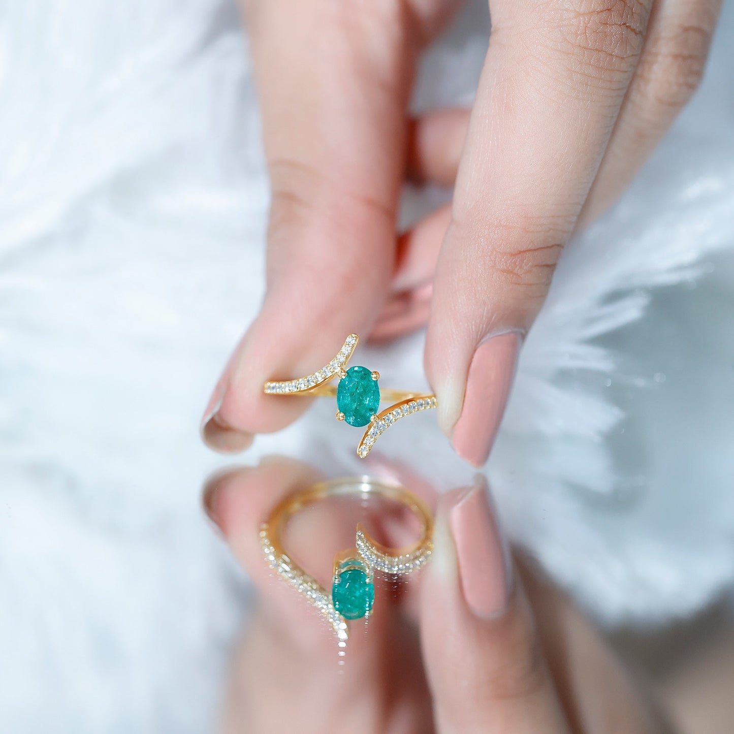 Oval Shaped Emerald Bypass Engagement Ring with Diamonds