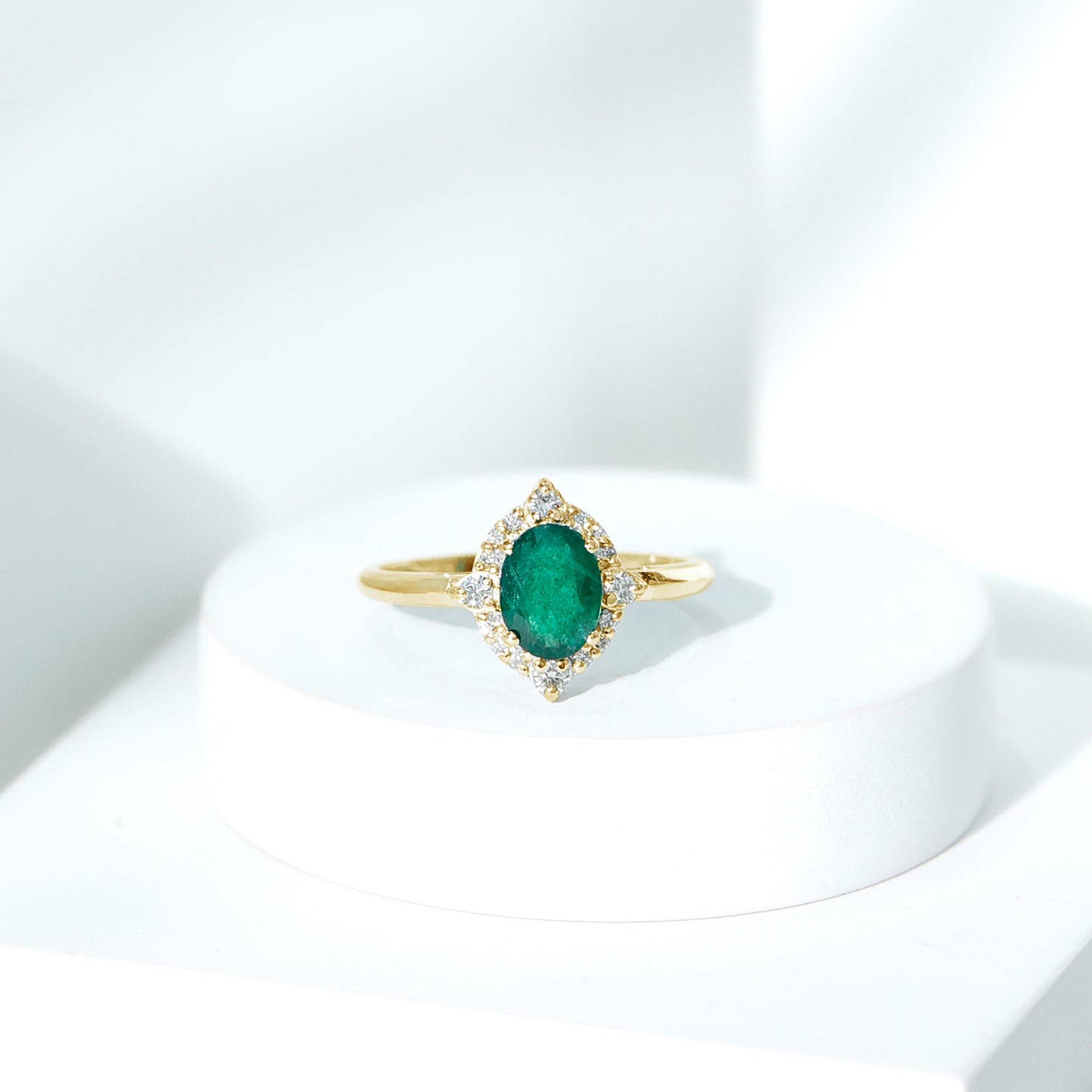 Vintage Looking Emerald Oval Engagement Ring with Diamond Halo
