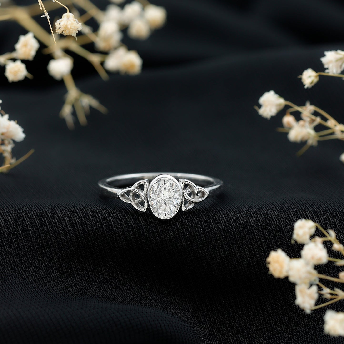 Oval Moissanite Solitaire Celtic Knot Ring in Bezel Setting