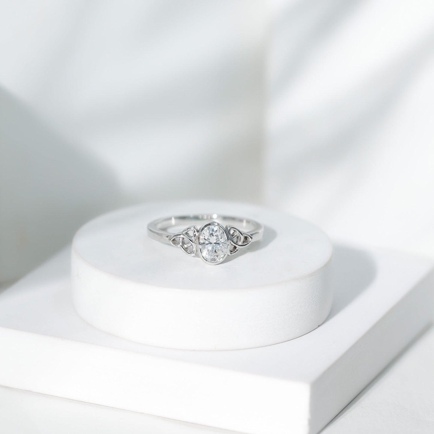 Oval Moissanite Solitaire Celtic Knot Ring in Bezel Setting