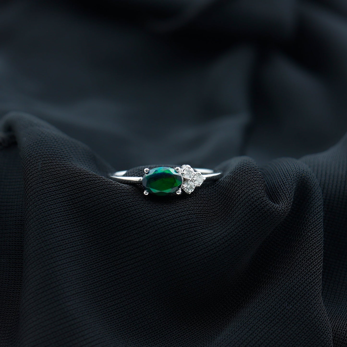 Oval Black Opal East West Ring with Diamond Trio