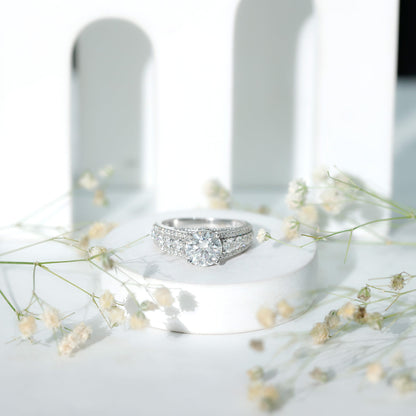 Round Brilliant Cut Moissanite Side Stone Engagement Ring